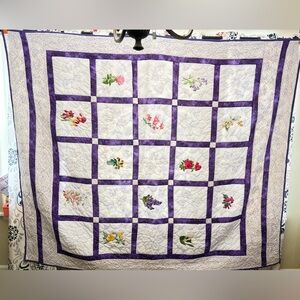 handmade quilt with embroidered state flowers called "Flowers on my Mind".